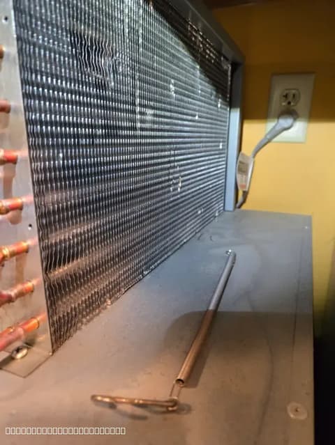 Refrigerator coil being repaired by Luxe Appliances Repairs technician in the Sacramento area.